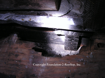 Close-up of the improperly installed WOOD hearth of the same fireplace.